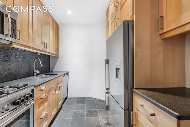 66 Madison Ave Unit 1D, New York City, NY 10016 - kitchen featuring appliances with stainless steel finishes, backsplash, dark stone counters, recessed lighting, and light brown cabinets