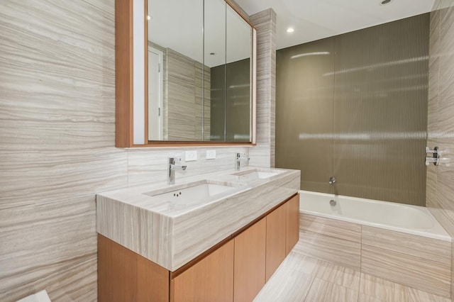 50 W St Unit 49-D, New York City, NY 10006 - bathroom with double vanity, tile patterned flooring, and tile walls