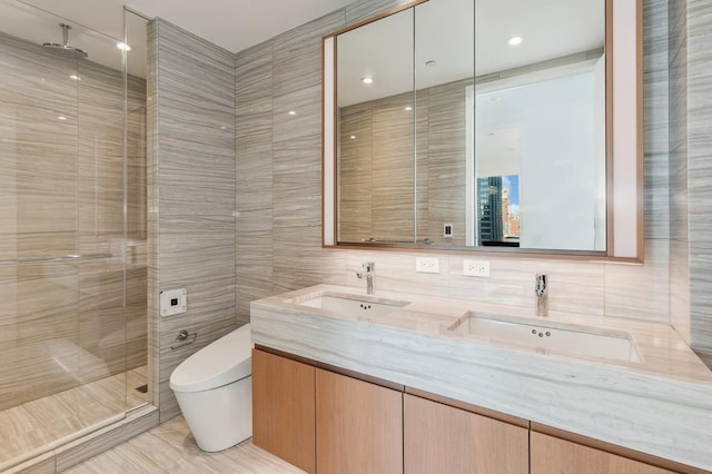50 W St Unit 49-D, New York City, NY 10006 - full bath featuring tile walls, a shower stall, toilet, and double vanity