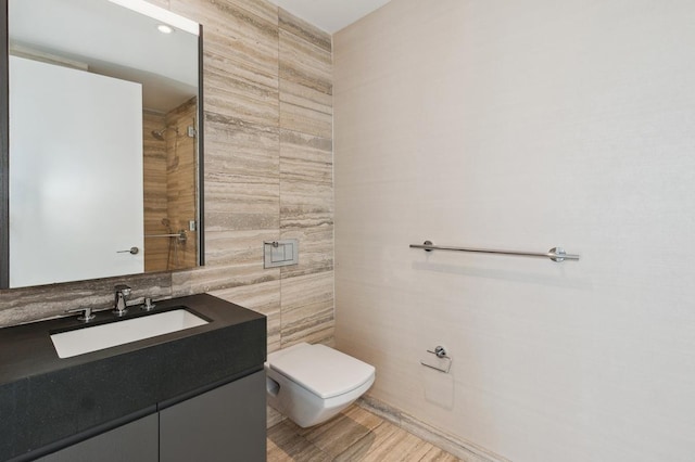 50 W St Unit 49-D, New York City, NY 10006 - bathroom with tile walls, toilet, and vanity