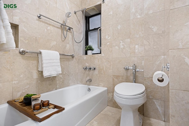 1049 Park Ave Unit 7A, New York City, NY 10028 - bathroom featuring tile walls, a tub to relax in, toilet, and tile patterned flooring