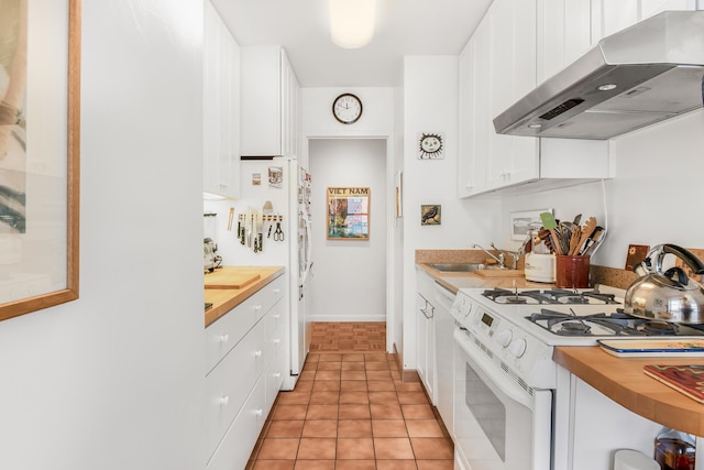 80 La Salle St Unit 18A, New York City, NY 10027 - kitchen with gas range gas stove, range hood, butcher block counters, and white cabinetry