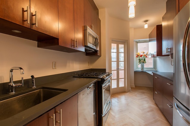 205 E 63rd St Unit 12C, New York City, NY 10065 - kitchen with appliances with stainless steel finishes, dark countertops, brown cabinets, and french doors