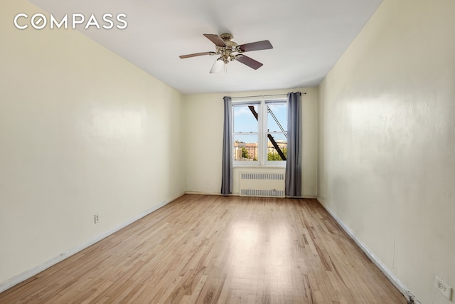 9801 Shore Rd Unit 4P, New York City, NY 11209 - empty room with radiator, light wood-style floors, and ceiling fan
