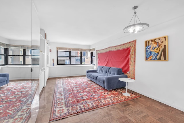 11 E 87th St Unit 9F, New York City, NY 10128 - living room with a chandelier and baseboards