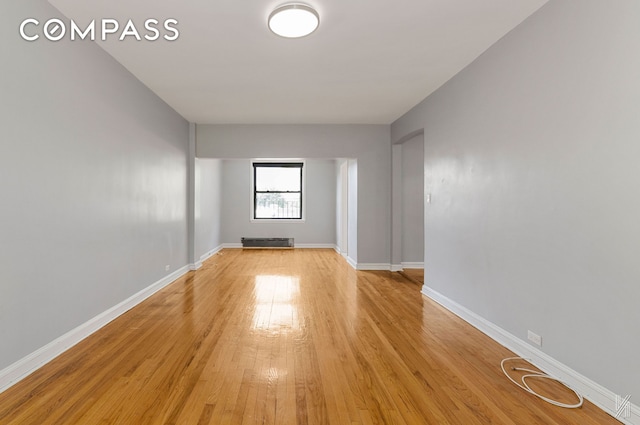 22-20 76th St Unit C3, New York City, NY 11370 - unfurnished room featuring light wood-style flooring and baseboards
