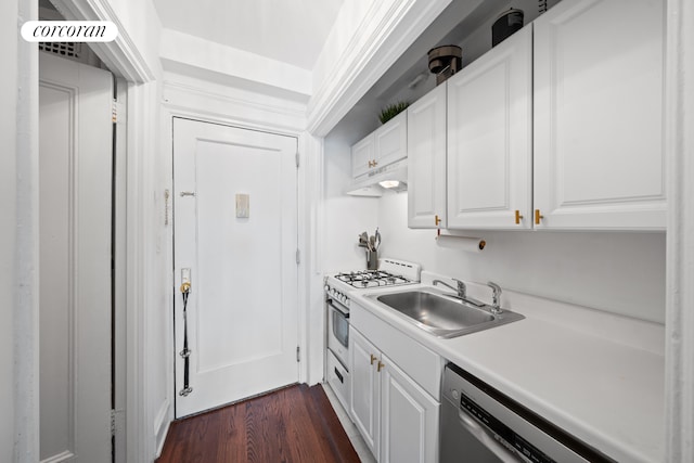 433 W 34th St Unit 15B, New York City, NY 10001 - kitchen with under cabinet range hood, white gas range, dishwasher, white cabinets, and dark wood-style floors