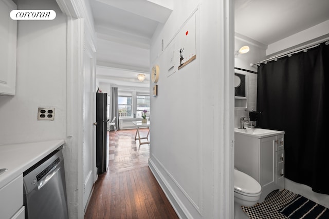433 W 34th St Unit 15B, New York City, NY 10001 - hallway featuring dark wood-style floors and a sink