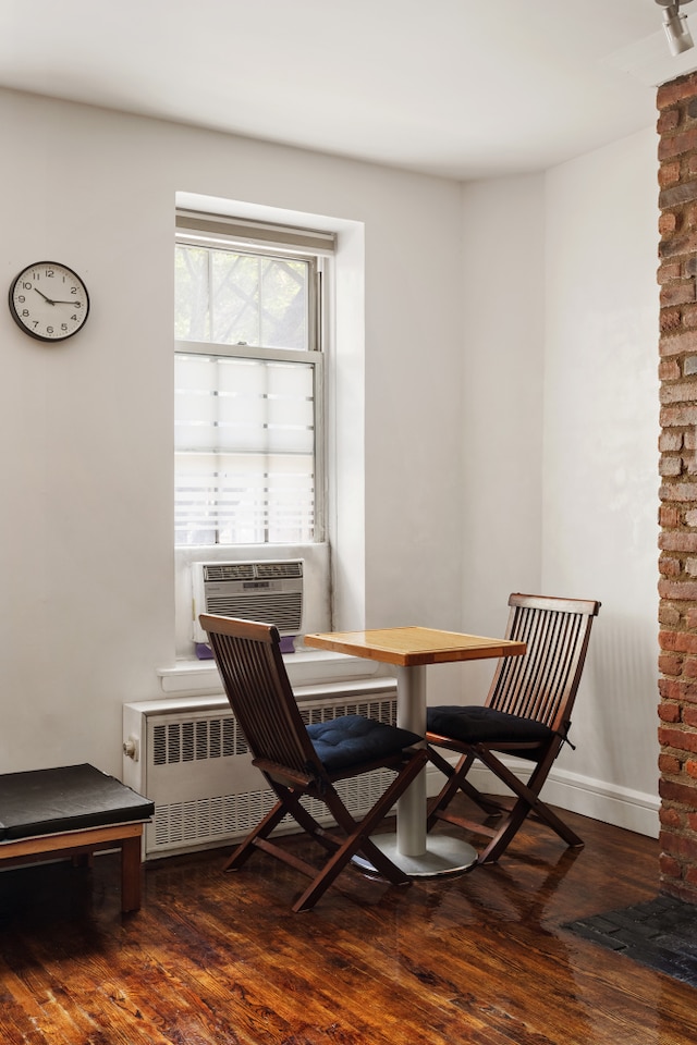 210 E 21st St Unit 2D, New York City, NY 10010 - dining room featuring wood finished floors and cooling unit