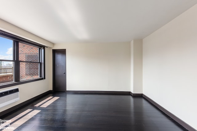 330 3rd Ave Unit 18B, New York City, NY 10010 - spare room with dark wood finished floors and a wall mounted air conditioner