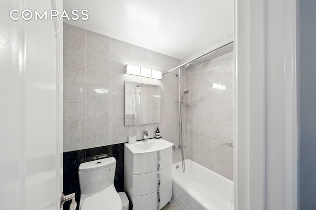 1360 Ocean Pkwy Unit 7B, New York City, NY 11230 - bathroom featuring vanity, bathtub / shower combination, and tile walls