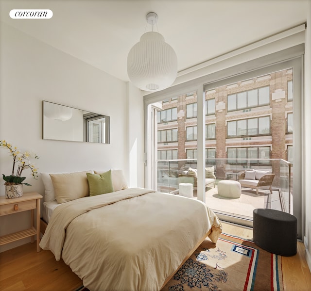547 W 47th St Unit Ph8, New York City, NY 10036 - bedroom with wood finished floors