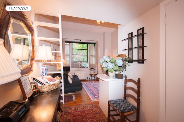 140 W 69th St Unit 26C, New York City, NY 10023 - corridor featuring radiator heating unit and wood finished floors
