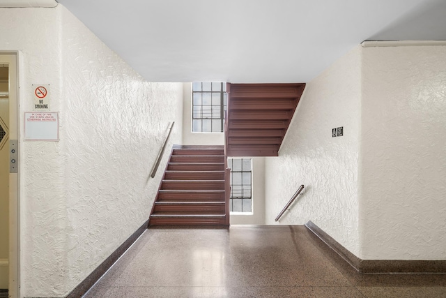41-25 44th St Unit C5, New York City, NY 11104 - stairs featuring a textured wall and speckled floor