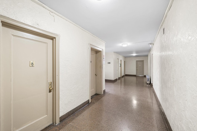 41-25 44th St Unit C5, New York City, NY 11104 - hall featuring radiator, speckled floor, and a textured wall