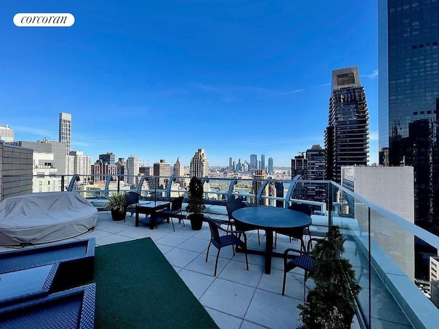 250 E 49th St Unit 3D, New York City, NY 10017 - view of patio with a skyline view and area for grilling