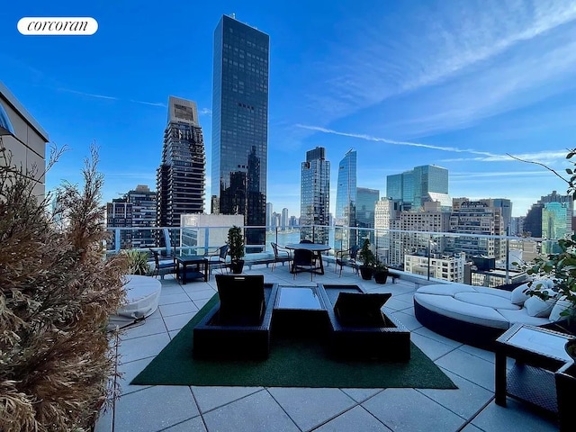 250 E 49th St Unit 3D, New York City, NY 10017 - view of patio / terrace featuring a skyline view and an outdoor hangout area