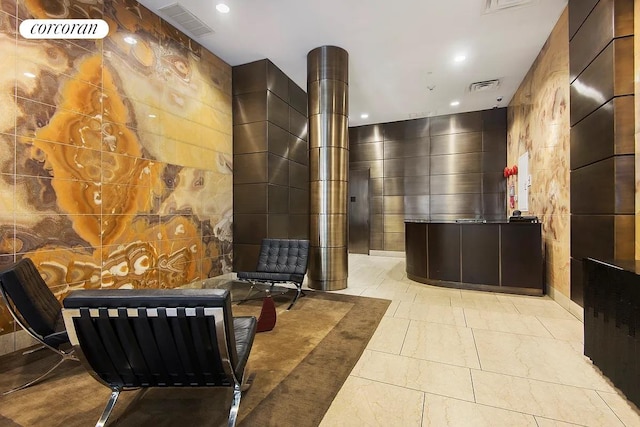 250 E 49th St Unit 3D, New York City, NY 10017 - reception featuring tile walls and recessed lighting