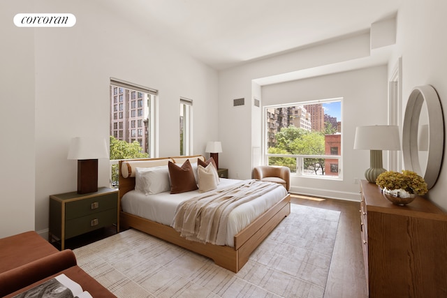 250 E 49th St Unit 3D, New York City, NY 10017 - bedroom with wood finished floors and baseboards