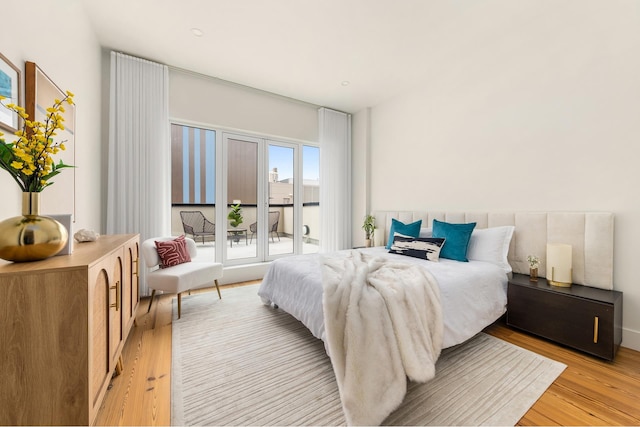427 E 90th St Unit Penthouse9, New York City, NY 10128 - bedroom with access to exterior and light wood-type flooring