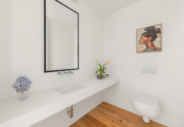 427 E 90th St Unit Penthouse9, New York City, NY 10128 - bathroom featuring toilet and wood finished floors