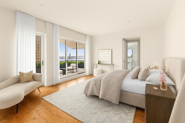 427 E 90th St Unit Penthouse9, New York City, NY 10128 - bedroom featuring access to outside, light wood-style floors, and ensuite bath