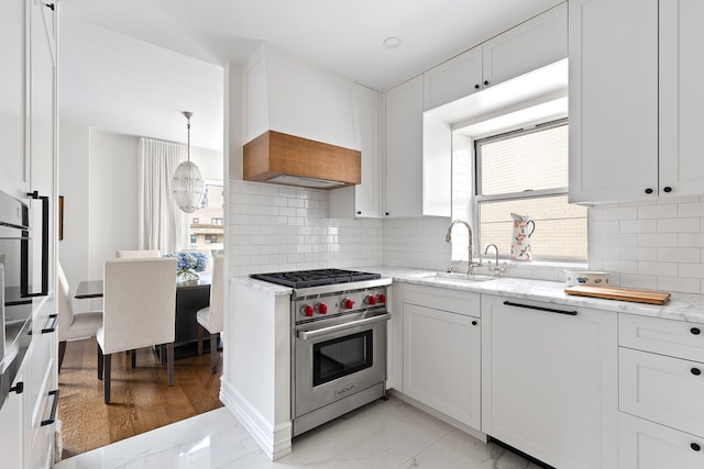 430 E 56th St Unit 11B, New York City, NY 10022 - kitchen with designer stove, light stone countertops, custom range hood, and decorative backsplash