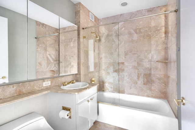 845 United Nations Plz Unit 11-C, New York City, NY 10017 - bathroom featuring shower / bathtub combination, vanity, and tile walls