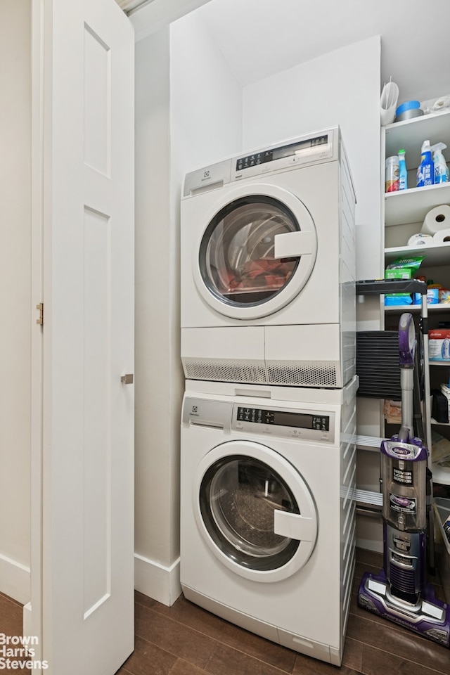 303 E 57th St Unit 14G, New York City, NY 10022 - laundry room with estacked washer and dryer and wood finish floors