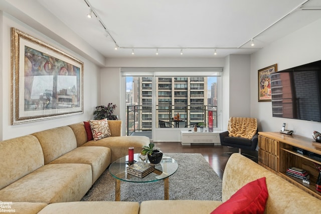 303 E 57th St Unit 14G, New York City, NY 10022 - living area with track lighting, wood finished floors, and plenty of natural light