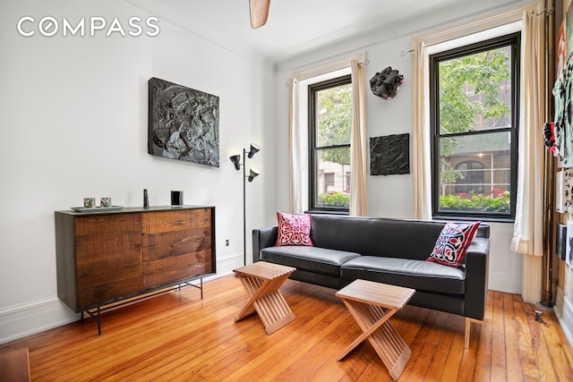223 W 21st St Unit 1M, New York City, NY 10011 - living area featuring light wood finished floors and baseboards