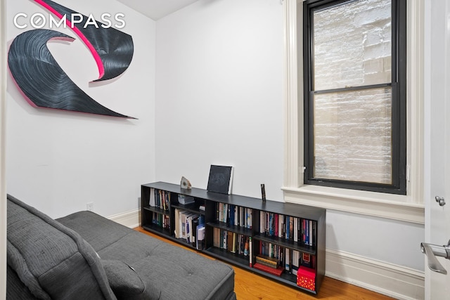 223 W 21st St Unit 1M, New York City, NY 10011 - sitting room featuring wood finished floors and baseboards