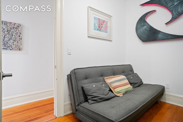 223 W 21st St Unit 1M, New York City, NY 10011 - sitting room with wood finished floors and baseboards