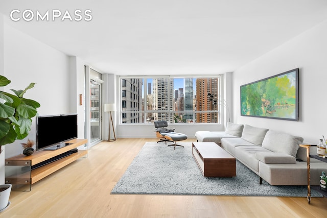 301 E 61st St Unit 12B, New York City, NY 10065 - living area with wood finished floors