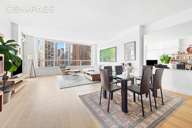 301 E 61st St Unit 12B, New York City, NY 10065 - dining area with wood finished floors