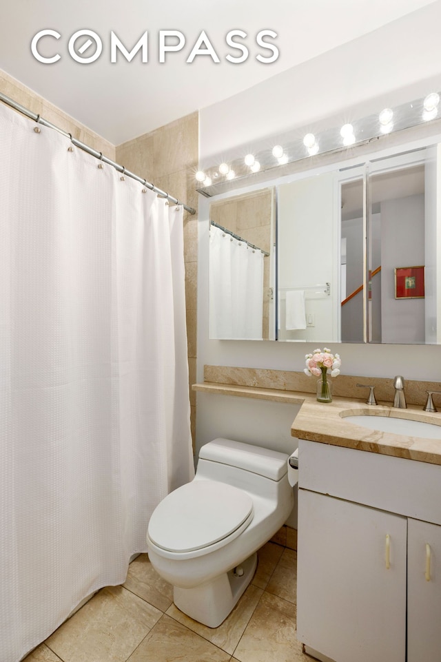 393 W 49th St Unit 5C, New York City, NY 10019 - full bathroom featuring vanity, tile patterned floors, and curtained shower