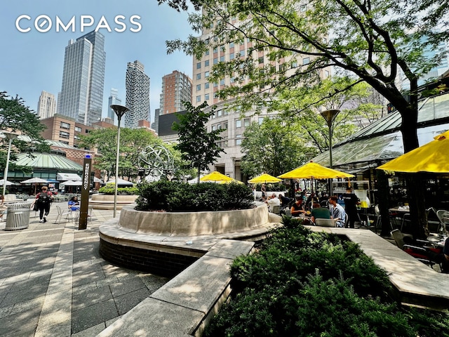 393 W 49th St Unit 5C, New York City, NY 10019 - view of community featuring a skyline view