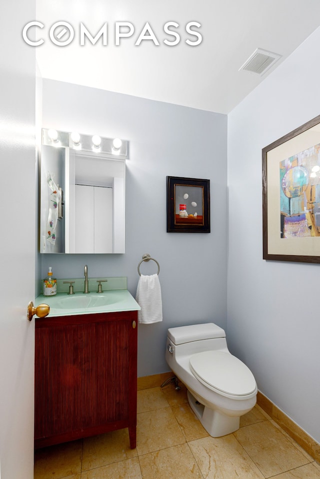 393 W 49th St Unit 5C, New York City, NY 10019 - half bath with baseboards and vanity