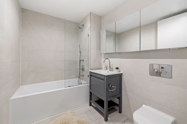 153 Green St Unit 1B, New York City, NY 11222 - full bathroom with shower / tub combination, vanity, tile walls, and tile patterned floors