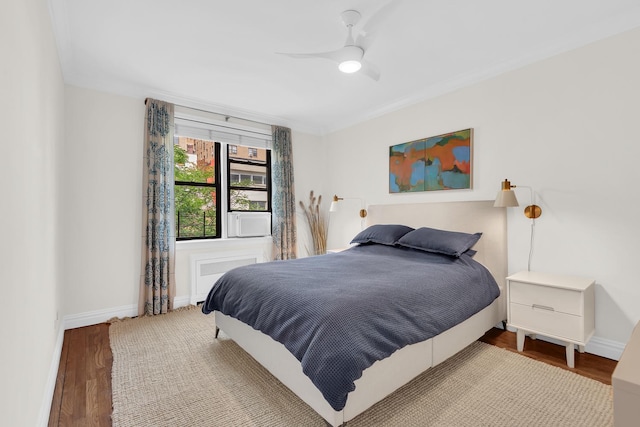 160 W 85th St Unit 5H, New York City, NY 10024 - bedroom with wood finished floors, ornamental molding, and ceiling fan