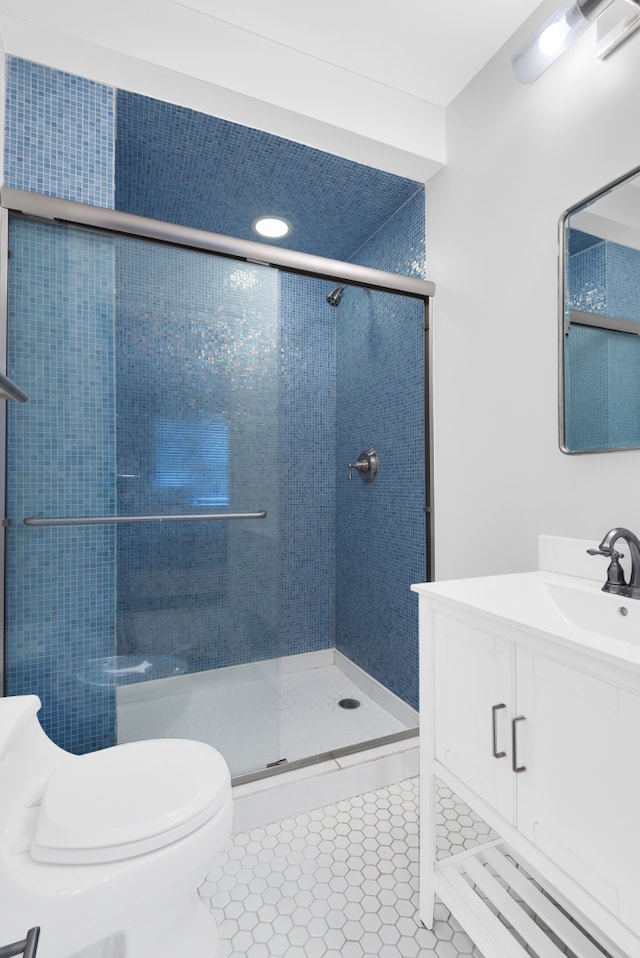 160 W 85th St Unit 5H, New York City, NY 10024 - bathroom with vanity, a stall shower, and tile patterned flooring