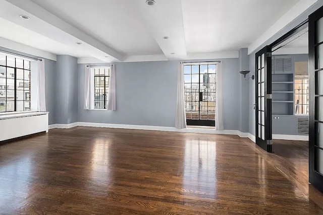 227 E 57th St Unit 12Eg, New York City, NY 10022 - spare room featuring wood finished floors and recessed lighting