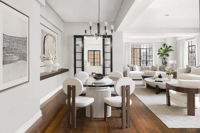 227 E 57th St Unit 12Eg, New York City, NY 10022 - dining area with a chandelier, wood finished floors, and plenty of natural light