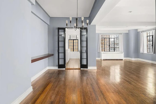 227 E 57th St Unit 12Eg, New York City, NY 10022 - unfurnished dining area with a chandelier and wood finished floors