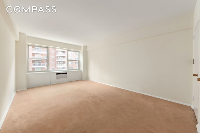 45 Sutton Pl S Unit 14N, New York City, NY 10022 - empty room with light colored carpet and a wall mounted AC