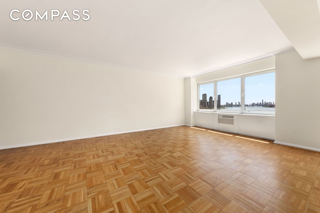 45 Sutton Pl S Unit 14N, New York City, NY 10022 - empty room with crown molding and a wall unit AC