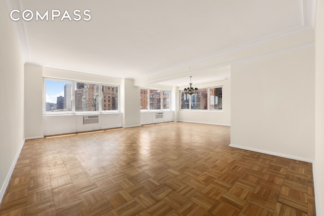 45 Sutton Pl S Unit 14N, New York City, NY 10022 - spare room with a chandelier, a wall mounted AC, and radiator