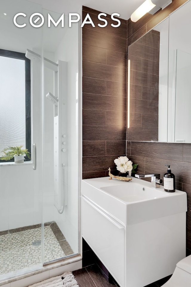 136 E Broadway Pha, Pha, New York City, NY 10002 - full bath featuring a stall shower, backsplash, and tile walls