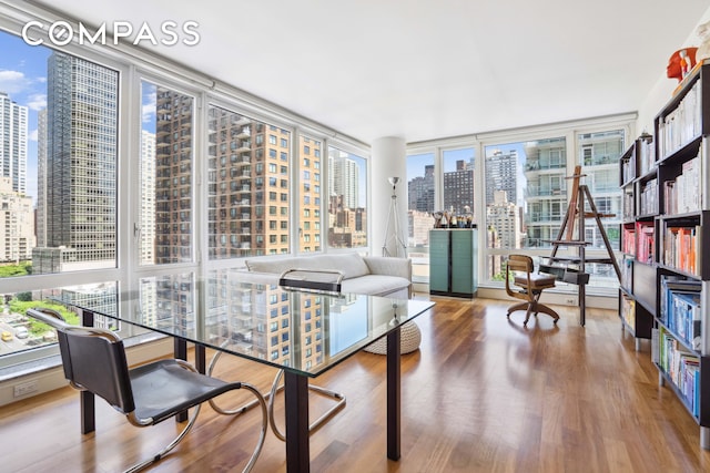 250 E 53rd St Unit 1402, New York City, NY 10022 - sunroom with a skyline view and plenty of natural light