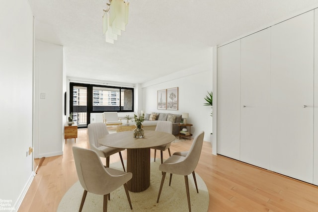 77 Fulton St Unit 9N, New York City, NY 10038 - dining space featuring light wood-style flooring